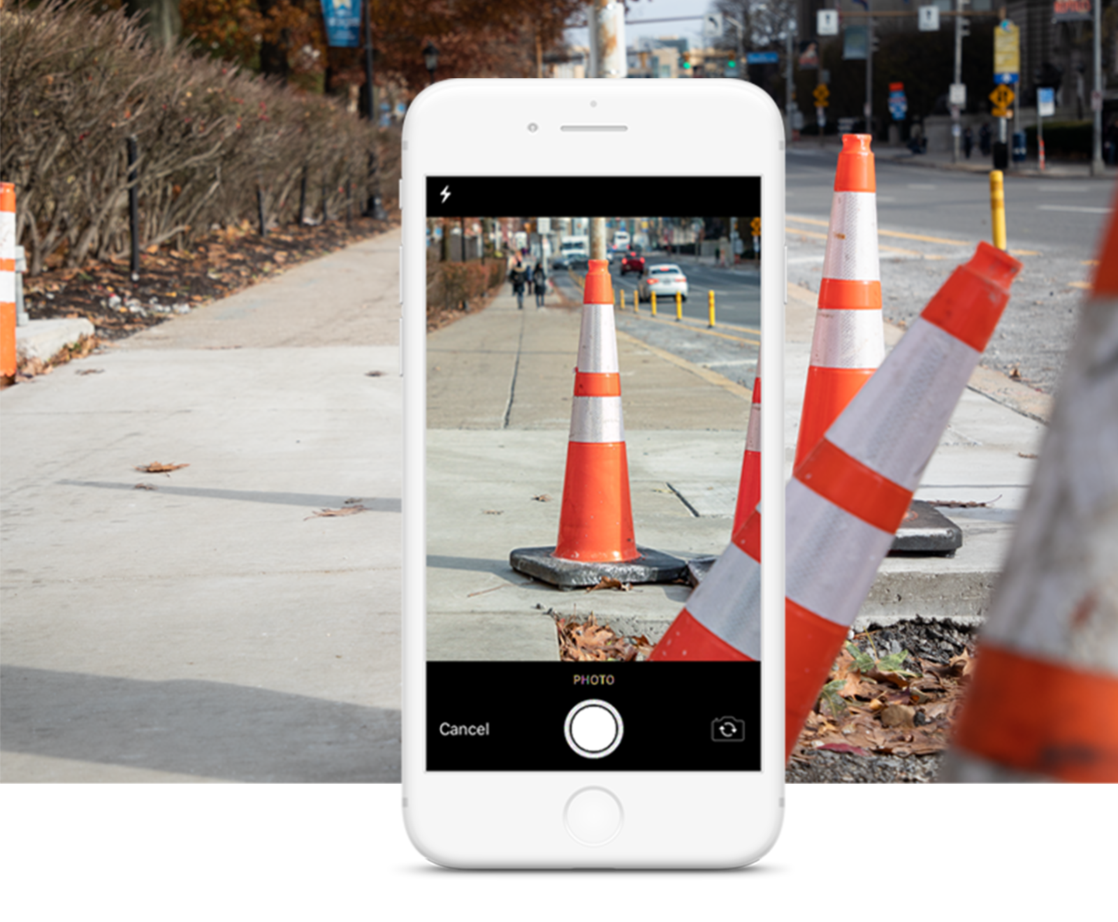 a sidewalk is under construction and a smartphone takes an image to report the obstruction to the pathVu mobile app